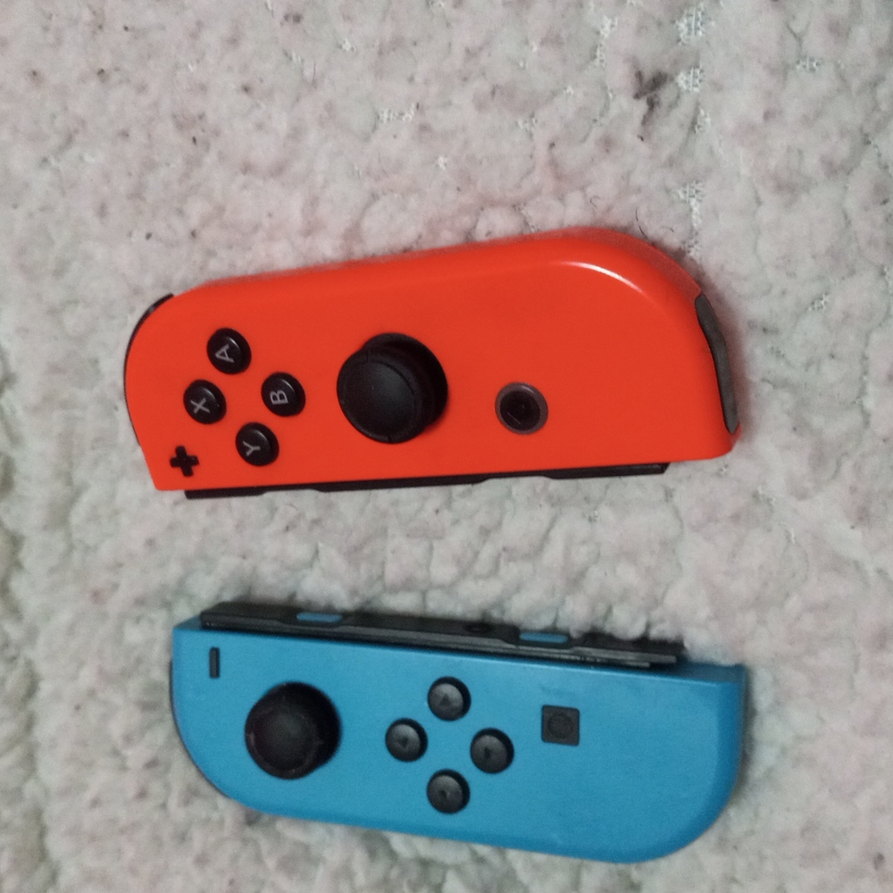 Pre owned Nintendo switch controllers 1 pink 1 blue